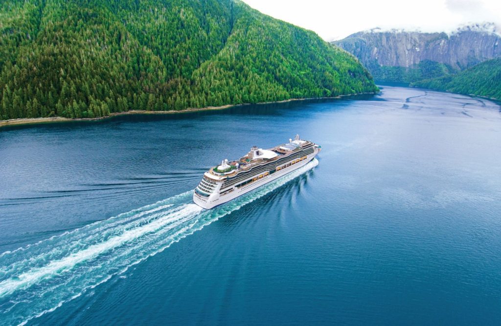 A Royal Caribbean International Cruise Shoip Sails down an Alaskan River